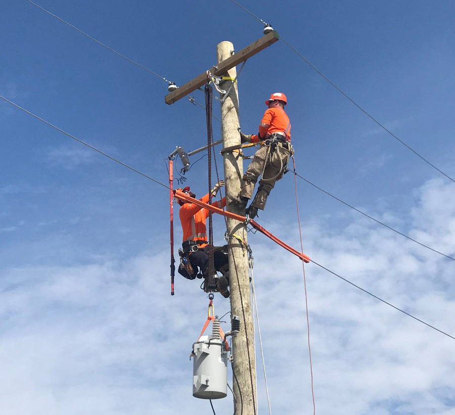 Hydro worker on a hydro pole